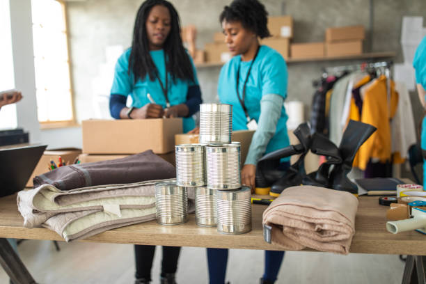 istock Volunteers preparing donation boxes for delivery, at a charitable foundation 1211346400
