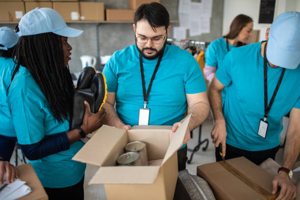 istock Volunteers packing humanitarian aid 1211346576