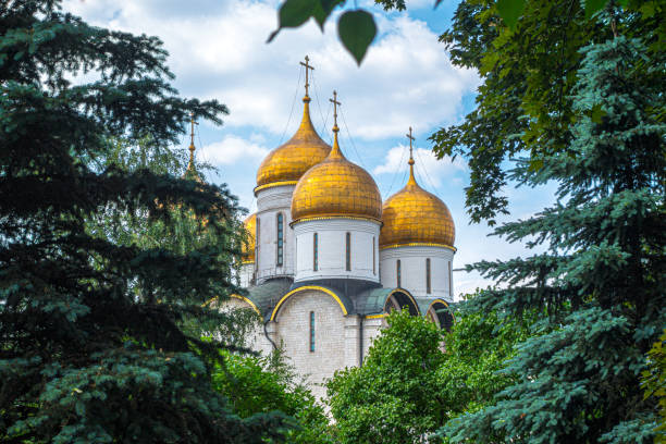 istock Dormition Cathedral inside Kremlin surrounded by trees in summer, Moscow, Russia 1211346966
