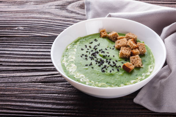 istock broccoli spinach cream soup on rustic wooden background 1211347015