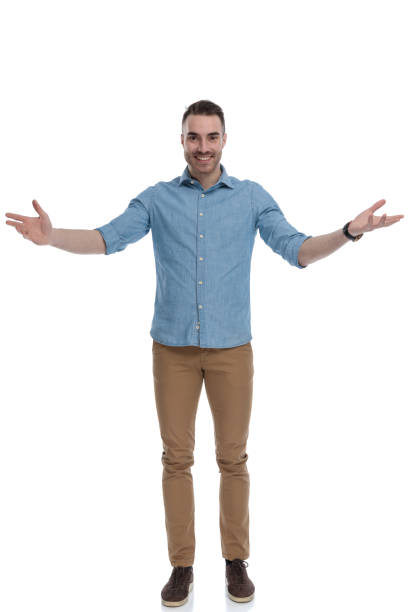 istock Cheerful casual man welcoming with his hands wide open 1211347171