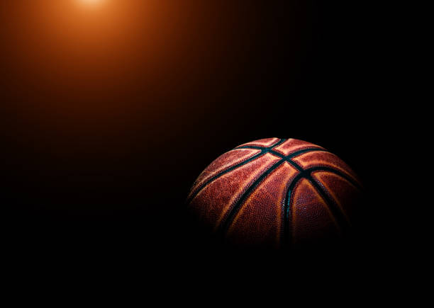 istock basketball ball on black background. 1211348688