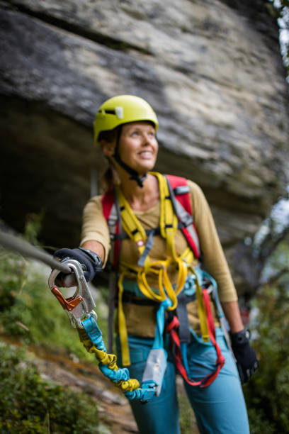 istock Pretty, female climber on a via ferrata 1211351468
