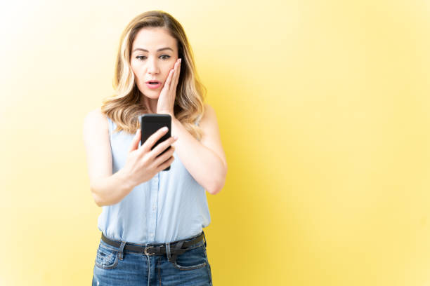 istock Surprised Caucasian Woman Using Cellphone 1211353730