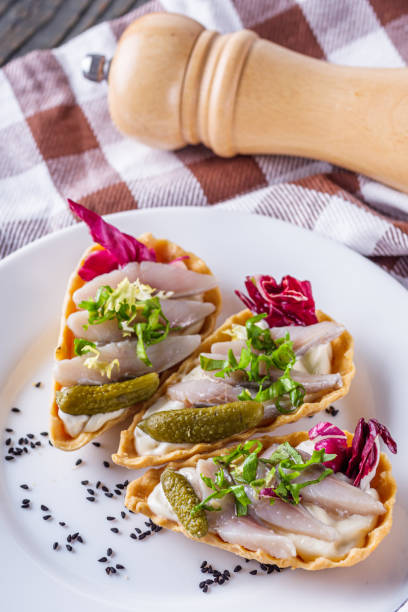 istock delicious snack tartlets on rustic wooden background 1211355029