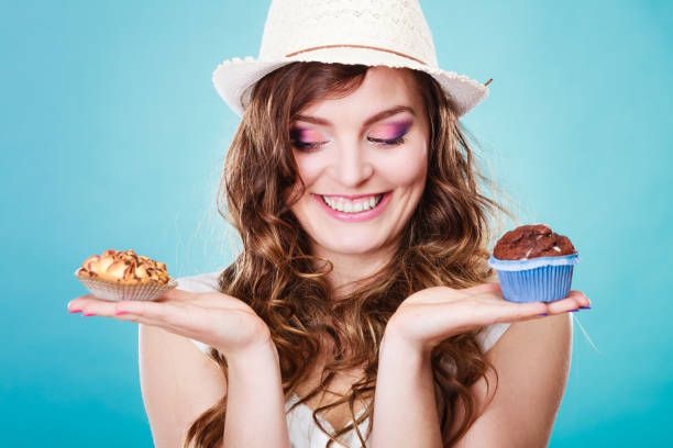 istock Smiling summer woman holds cakes in hand 1211356098
