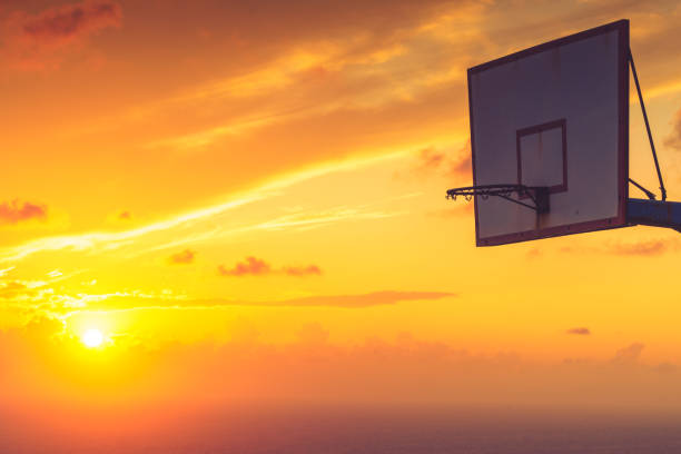 istock basketball basket against sunset sky 1211356409