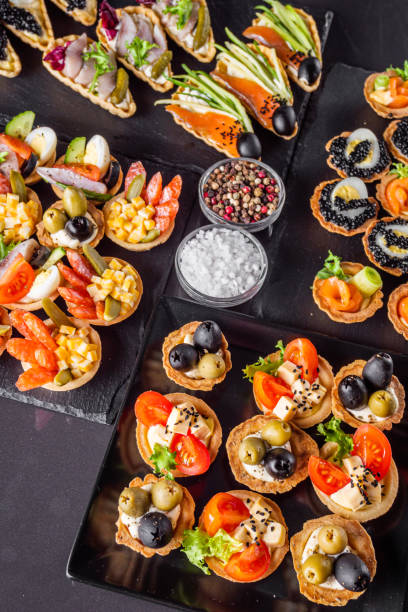 istock delicious snack tartlets on dark stone background 1211357203