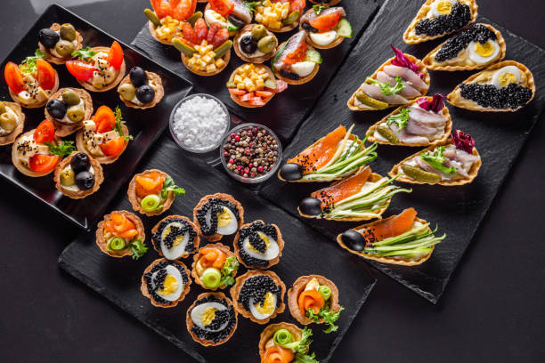 istock delicious snack tartlets on dark stone background 1211357489