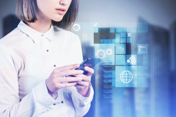 istock Woman with smartphone in city, business interface 1211357567