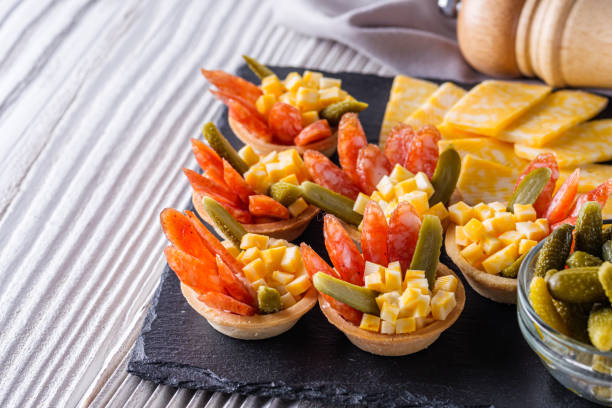 istock delicious snack tartlets on rustic wooden background 1211357714