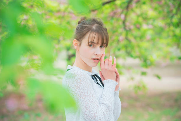 istock Young woman healed by trees 1211359231