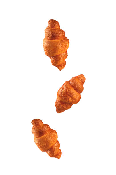 istock Croissants flying on white background. 1211359453