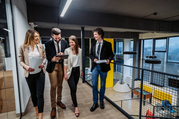 istock Businesspeople having a meeting in hallway 1211359523