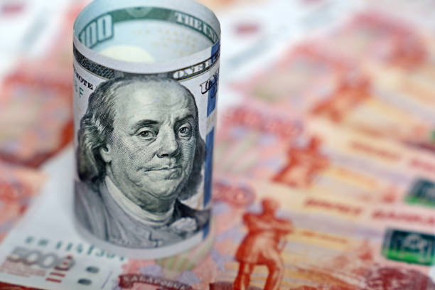 istock US dollar on russian rubles background 1211359830