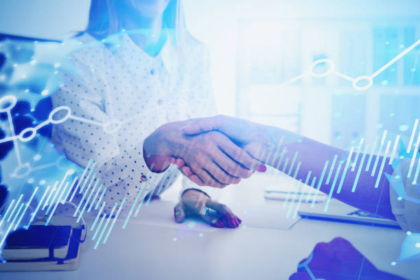istock Businesswomen shaking hands, world trade 1211360075