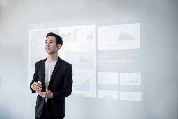 istock Confident male Speaker giving a talk during group therapy session. 1211360351