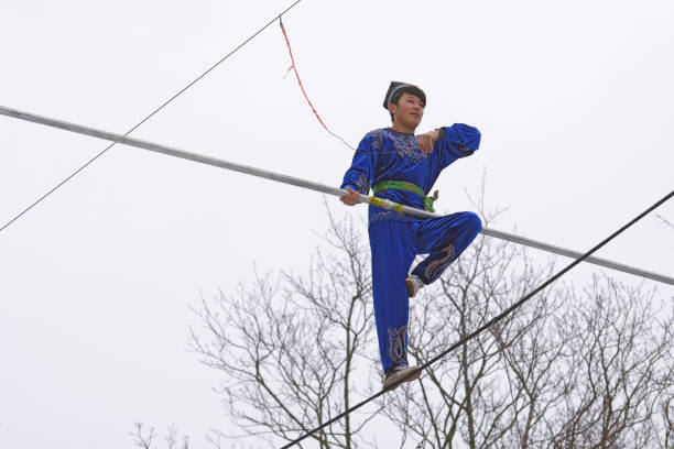 Saint - Petersburg.Russia.March 1.2020.Uzbek tightrope walkers perform at the festival of farewell to winter.This is a spectacular and dangerous attraction.