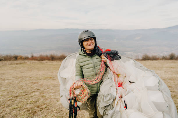 istock Senior woman carrying her parachute 1211361700
