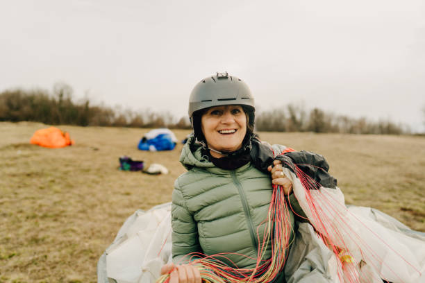 istock Senior woman carrying her parachute 1211361748