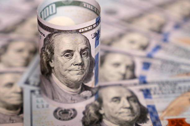 istock US dollar on background of dollars bills 1211362070