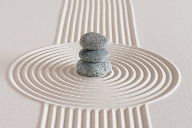 istock Japanese zen garden with stone in textured sand 1211362454