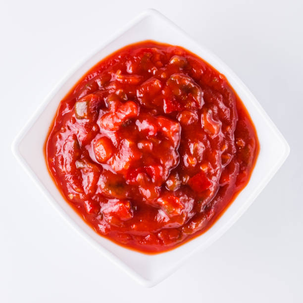 istock Fresh tasty tomato sauce on a white background 1211363290