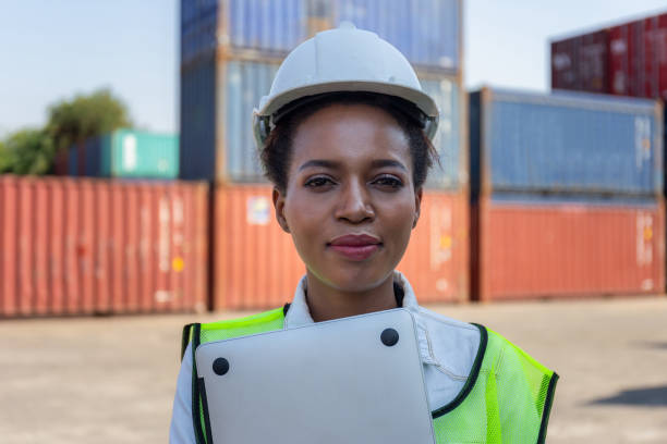 Cheerful factory worker woman in hard hat smiling and looking at camera, Happiness Female engineers for concept Cheerful factory worker woman in hard hat smiling and looking at camera, Happiness Female engineers for concept general manager stock pictures, royalty-free photos & images
