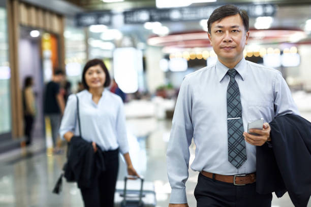 istock Executives arriving at airport for business trip 1211368315