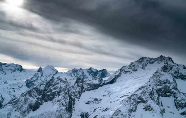 istock Mountain peaks at stormy weather 1211368608