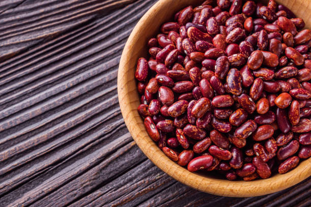 istock Fresh organic natural beans on wooden rustic background 1211368615