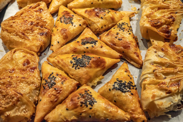 istock Golden brown baked puff pastry buns 1211371294