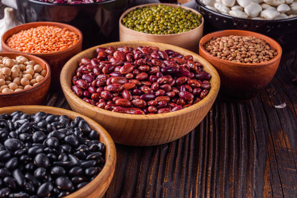 istock Fresh organic natural beans on wooden rustic background 1211373000