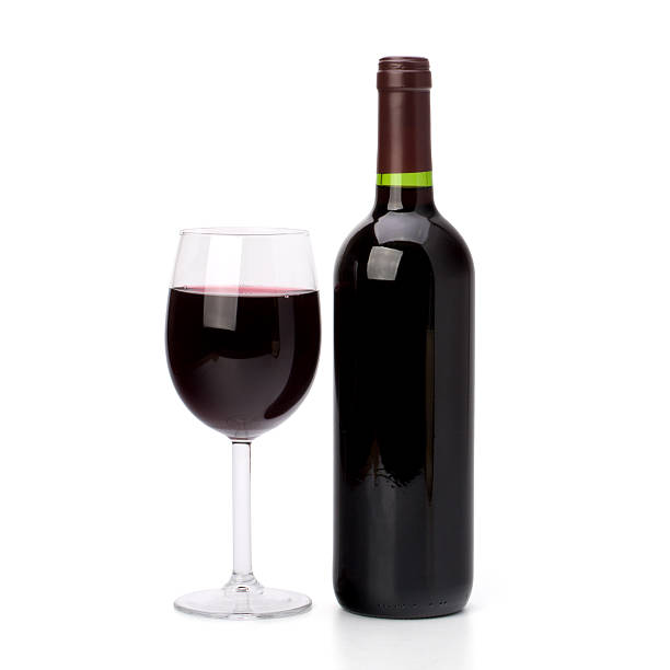 istock Full red wine glass goblet and bottle 121137349
