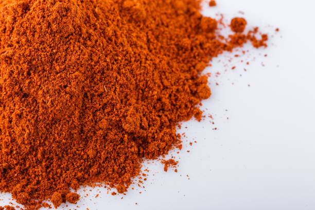 istock aromatic spicy chili powder on a white background 1211374024