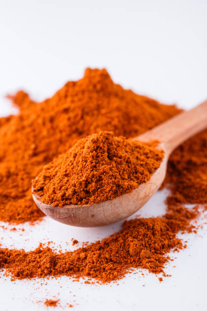 istock aromatic spicy chili powder on a white background 1211374113