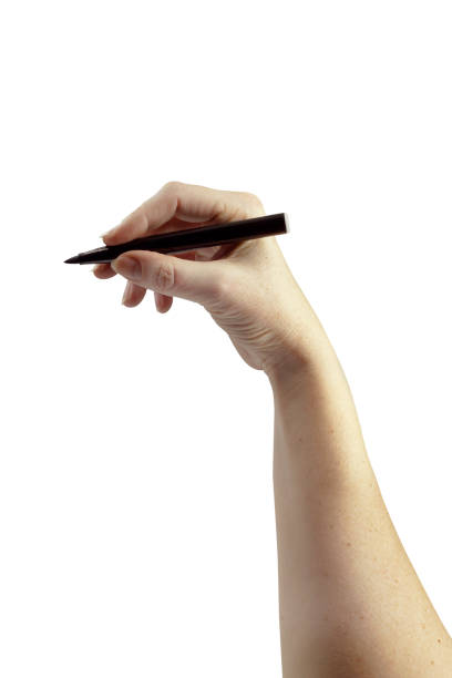istock Woman's elegant hand holding black marker on isolated white background. Series 1/3 1211374306