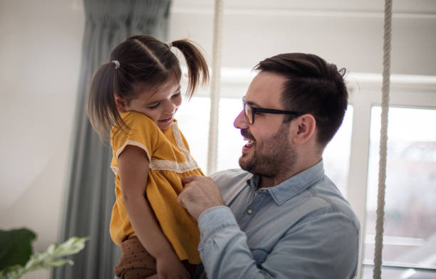 istock There's no place like dad's arms. 1211374531
