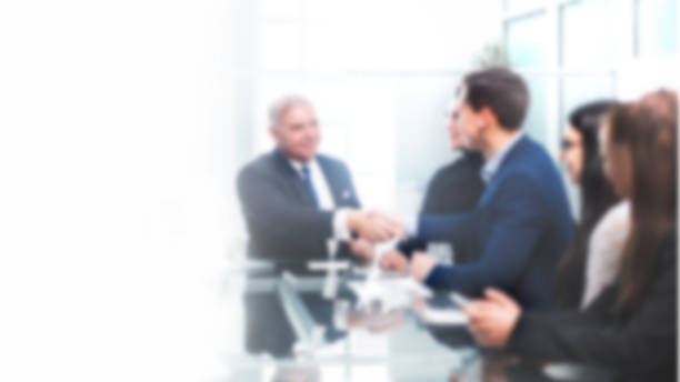 istock business colleagues shaking hands during a work meeting. background in blur 1211374550
