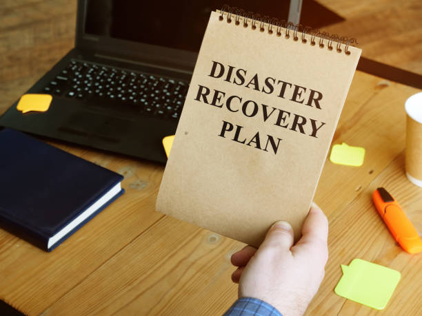 istock Disaster Recovery Plan in the man hands. 1211375490