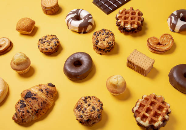 istock Sweet food pattern on a yellow paper background 1211376019