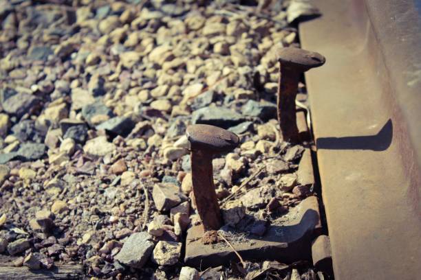 istock Railroad Spikes by the Tracks 1211377313