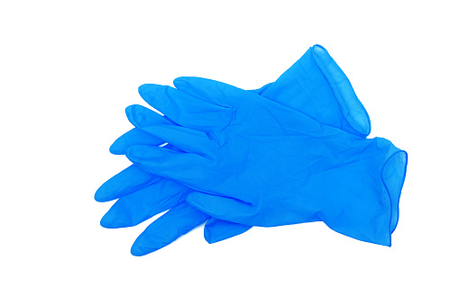 par de guantes médicos azules aislados sobre fondo blanco photo