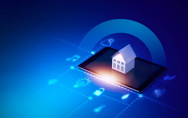 istock Small house model is on screen tablet and icons home electronics devices connecting with wireless. Smart home controlled 1211378914