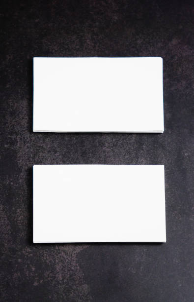 istock Mockup white business card on black background. 1211380611