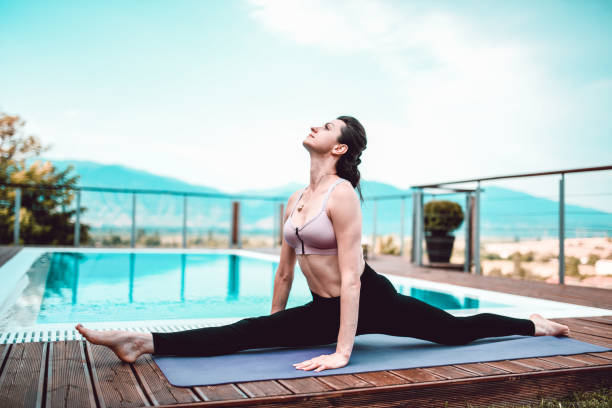 istock Female Gymnast Showing Perfect Front Full Split Exercise 1211381232