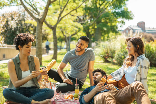 istock Friends meeting in public park 1211381410