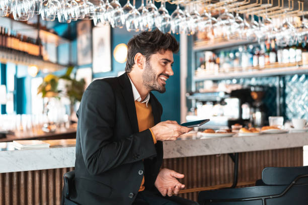 istock Young man sending audio at the bar 1211381412