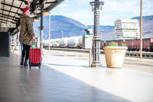 Woman waiting for a train on a train station