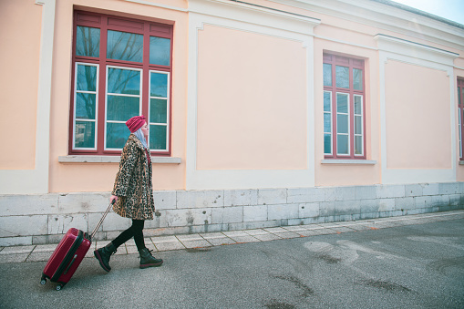 Woman walking with her suitcase